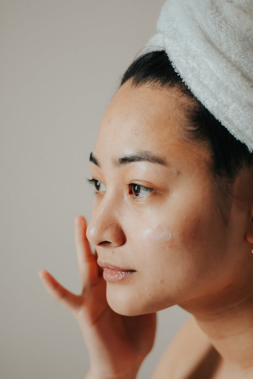 Woman Putting on Skincare