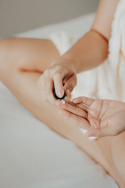 Woman Putting on Skincare